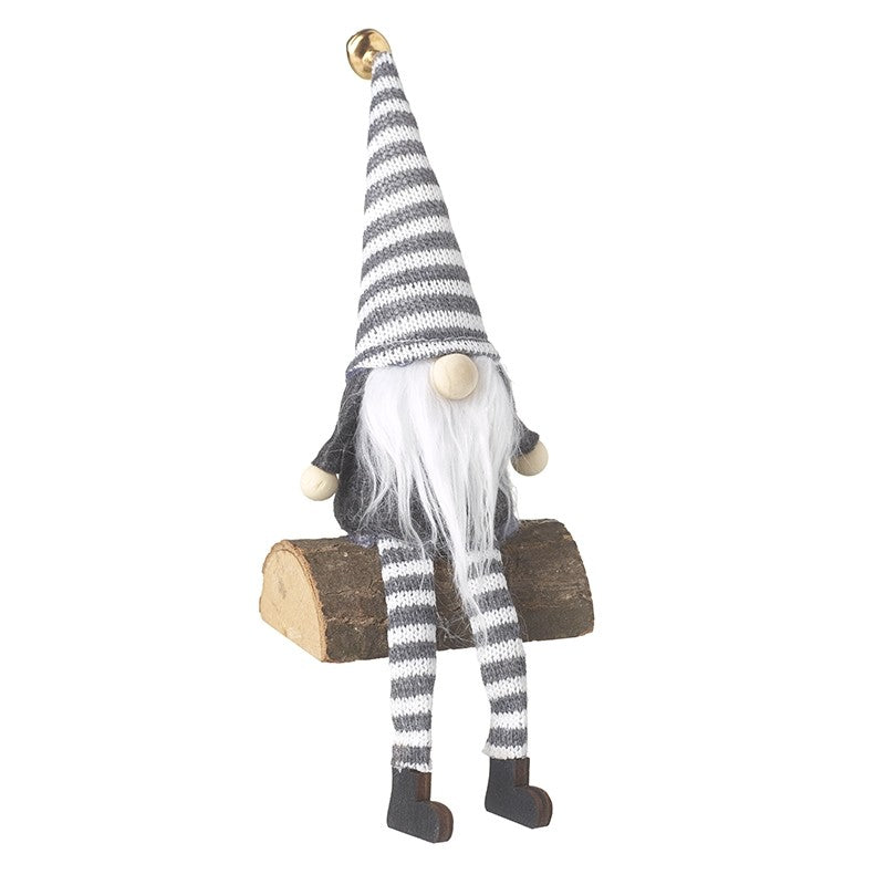 Grey & White Gonk Sitting On Log